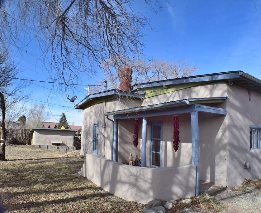 Front of casa with root cellar in background