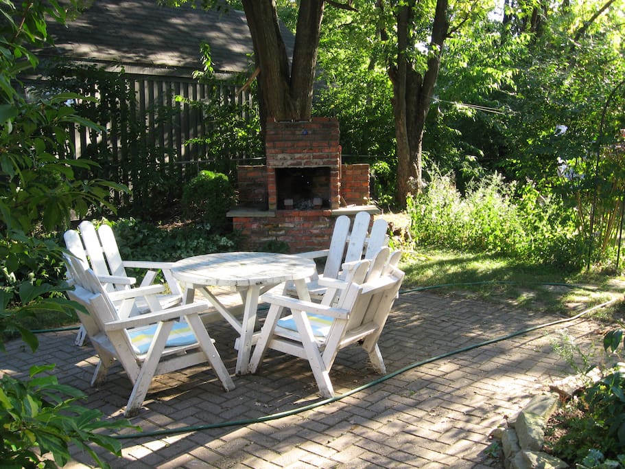 shaded patio with red brick barbecue