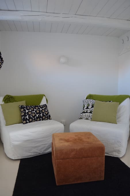 Two cosy chairs to watch tv in.