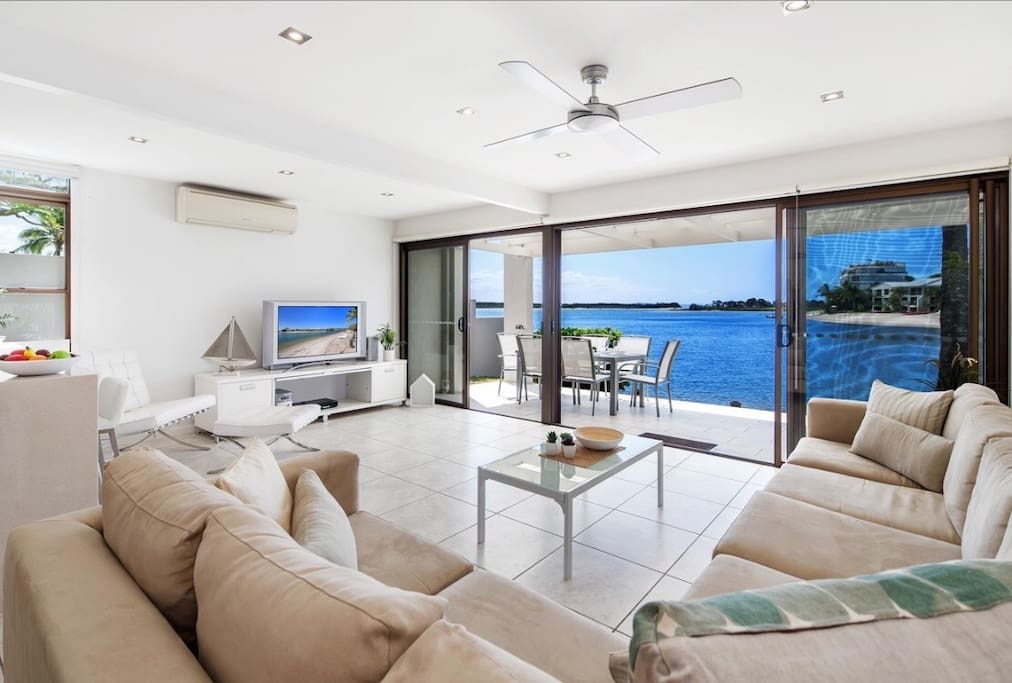 Step from living area straight onto private entertaining deck and beach
