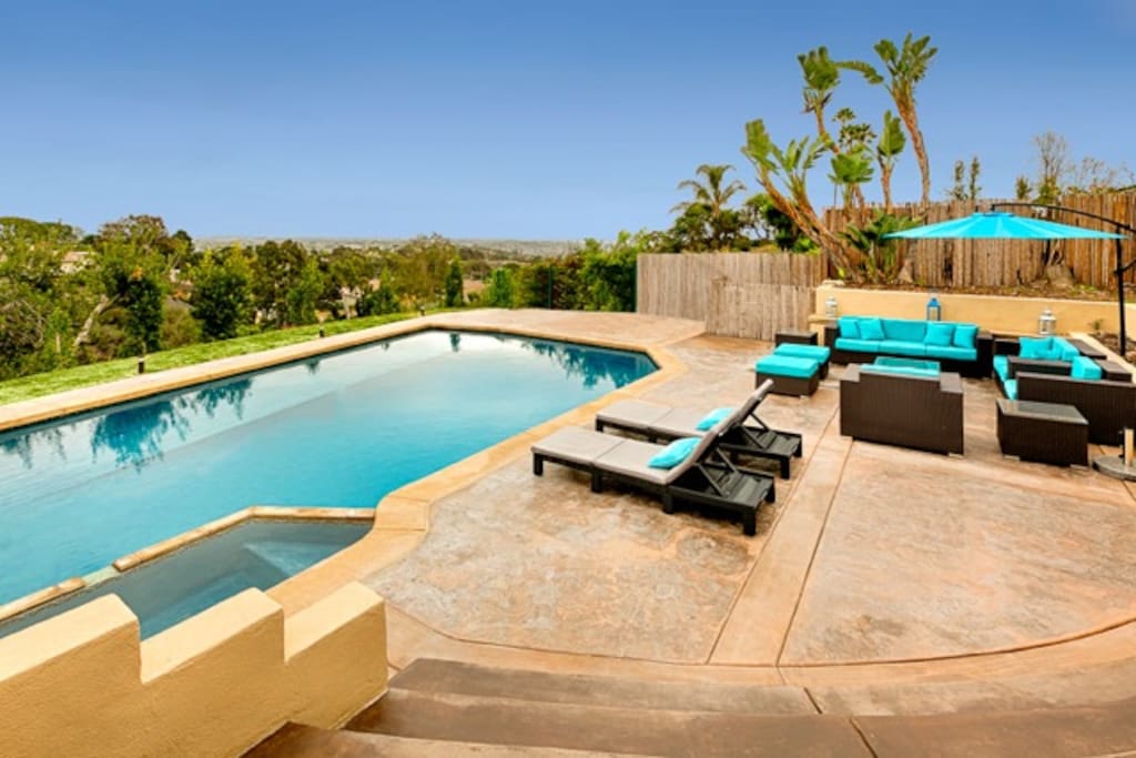 Pool and hot tub with plenty of patio furniture