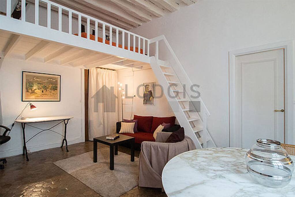 General view of the living room + mezzanine