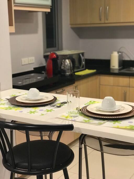 Dining and Kitchen area with complete utilities and kitchen wares