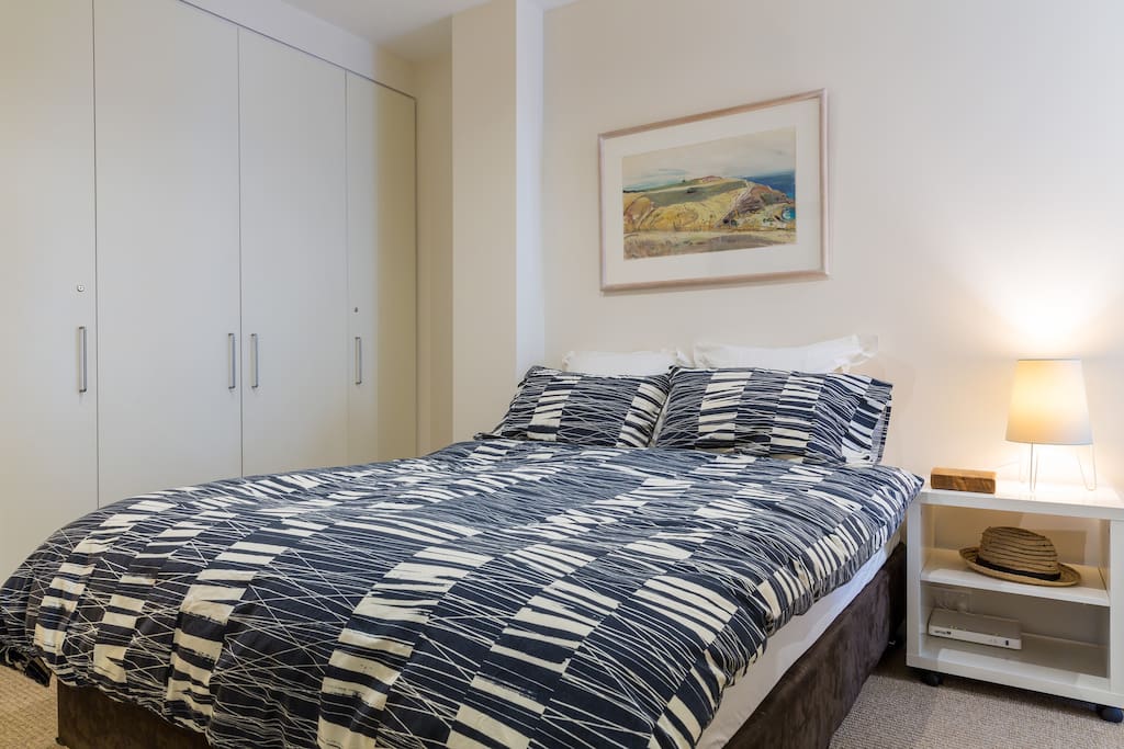 Comfortable, large bedroom, queen sized bed, with direct access to the balcony through a double glazed door.