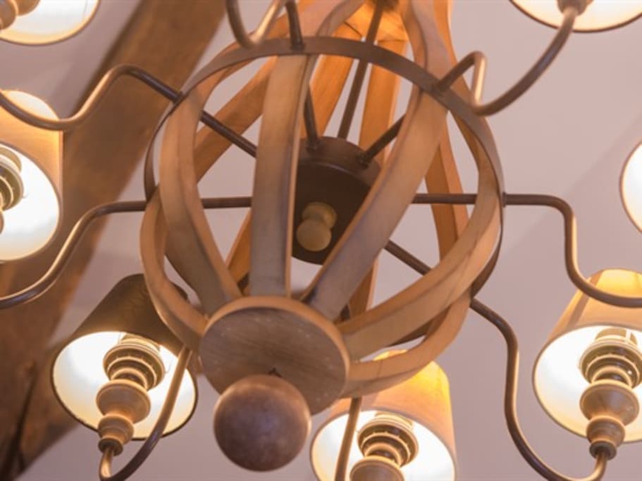 Stylish chandelier hanging from the vaulted ceiling.