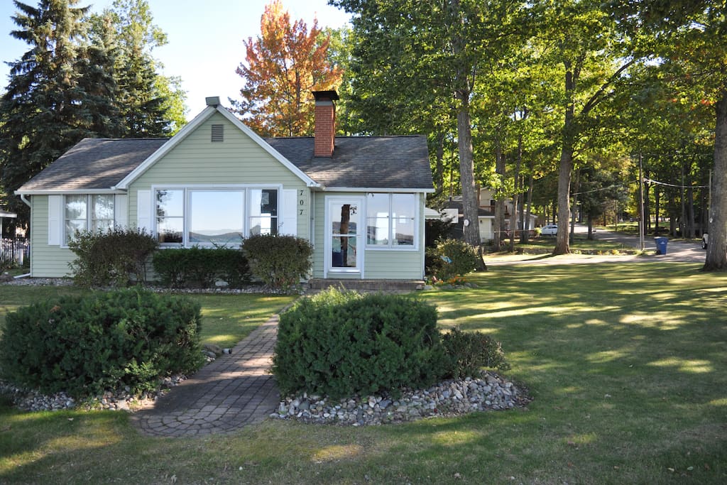 Front of the house facing North across the Lake. Side-yard that can handle a volleyball net, picnic tables and room for croquet court. All provided including his and her mountain bikes, canoe and kayak.