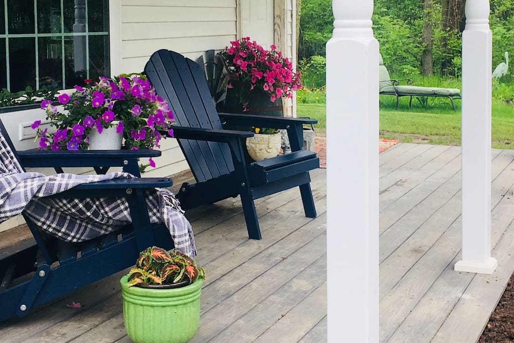 The spacious front porch, overlooking our pond and four-square garden is the perfect location to enjoy your morning coffee.