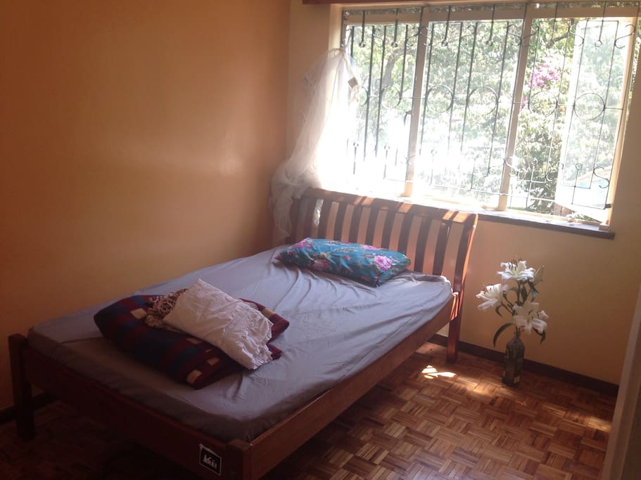 Bedroom - overlooking a beautiful acacia tree and the garden