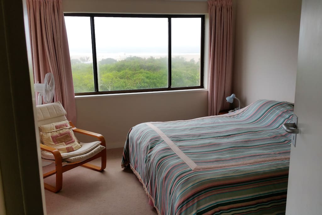 Main en suite bedroom which opens onto the veranda and enjoys the same views
