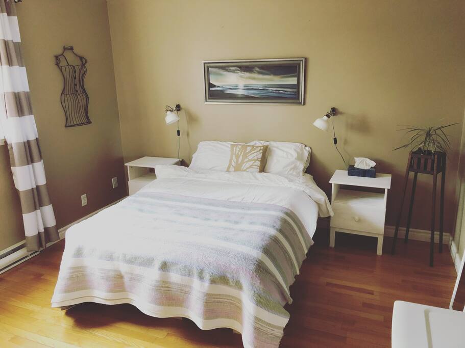 Your bright bedroom with new mattress and memory foam pillow topper!