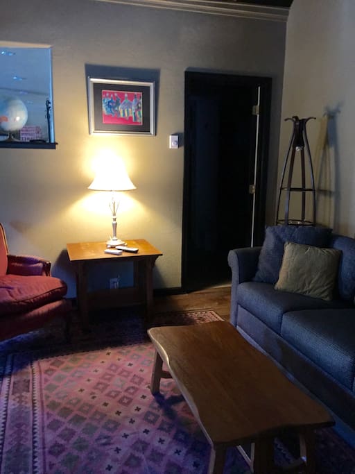 living area with queen sofa sleeper looking into bathroom