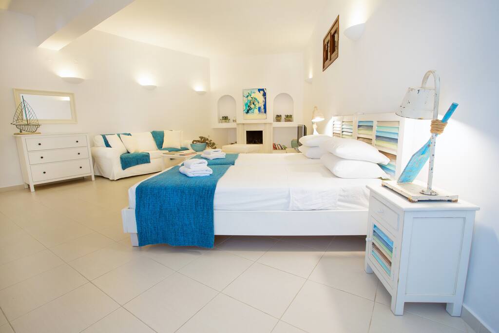 Open plan twin bedroom and living area inspired by the Lindian Architecture