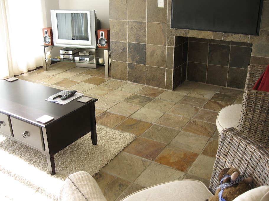 Lounge looking towards TV and fire, balcony is on left of TV
