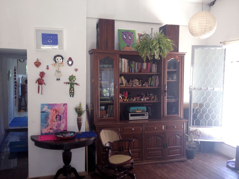 Living room + Atelier. If you want this semi circle table can be opened, there are other chairs and so you can have a meal table.