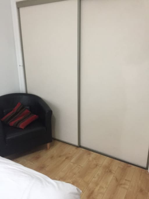 fitted wardrobes, comfy chair.