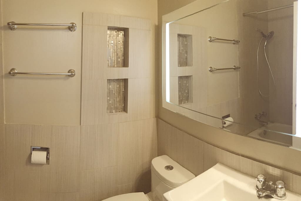 Newly renovated bathroom with massage shower.