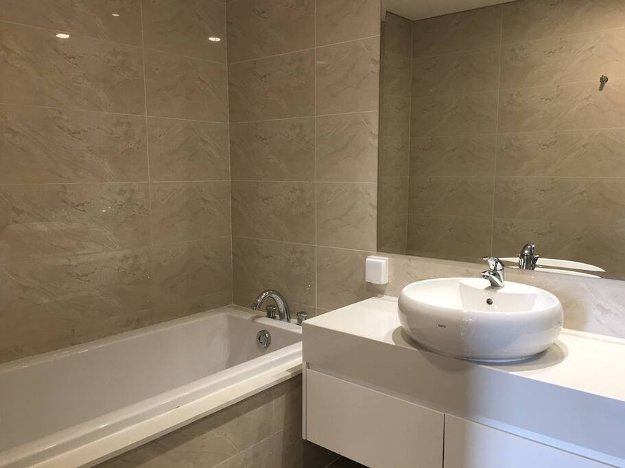 Bathroom with both bathtub and standing shower