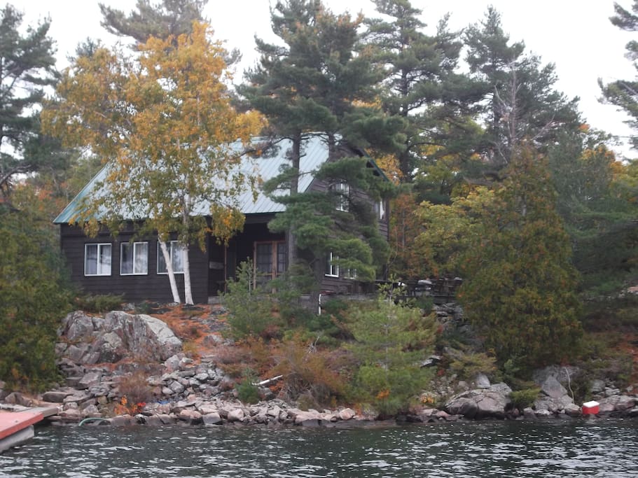 Cottage from the water in the fall.