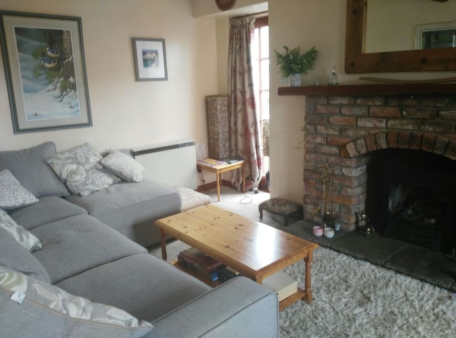 Open gas fire and corner sofa