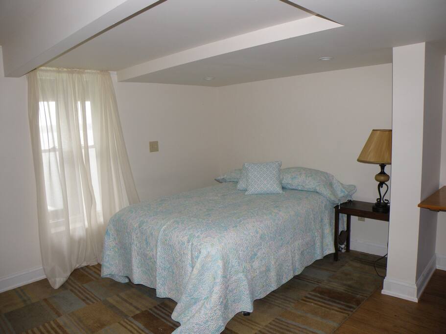 Guest suite with desk and sitting.