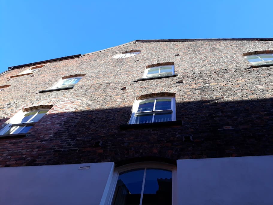 View of the apartment from below #historic building #converted mill #riverside apartment