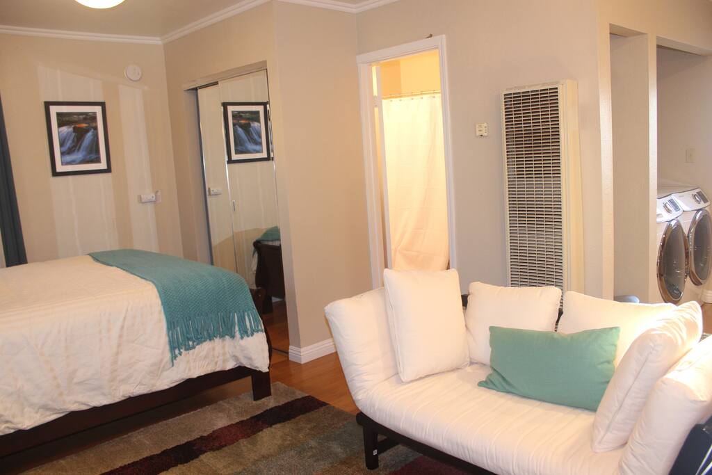 The queen bed to the left, the fold out love seat to the right and the bathroom straight back.