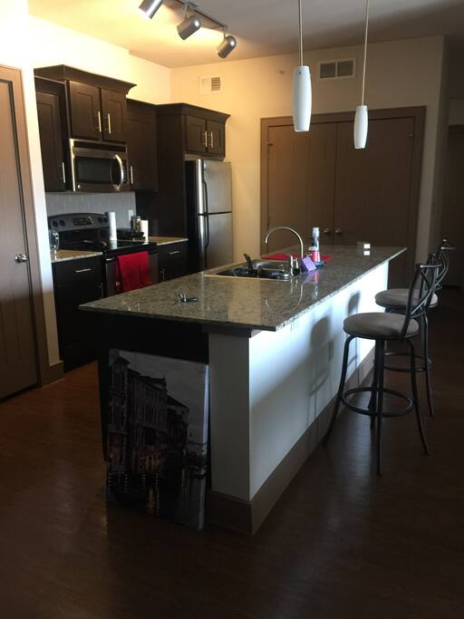 Kitchen with washer and dryer behind the closed doors, which you are welcome to use