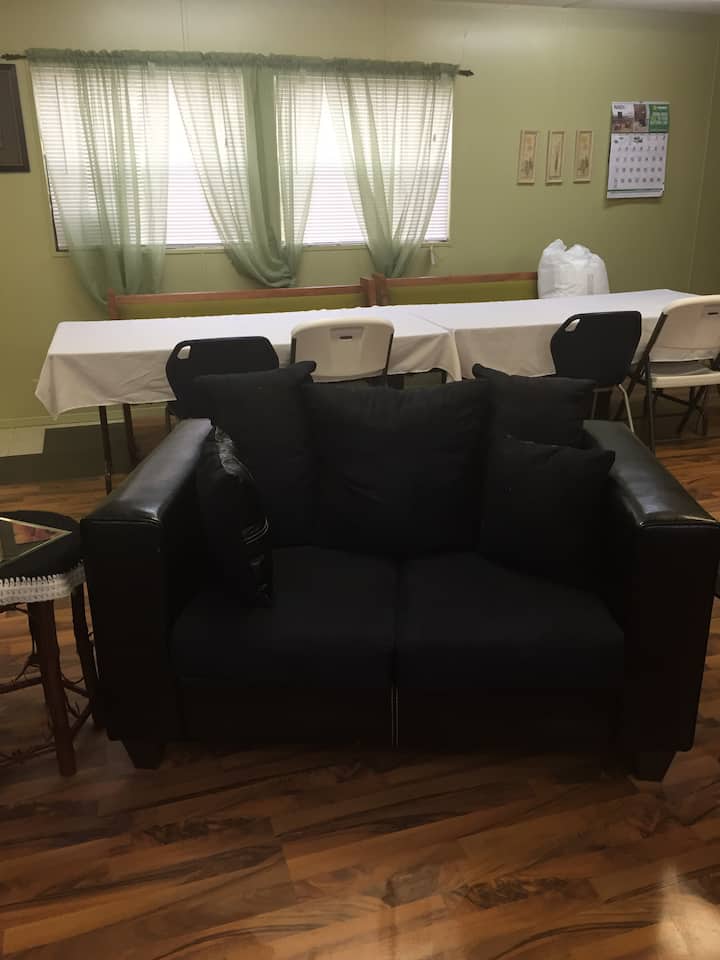 This one of the sitting areas. It includes love seat, Fulton, and another sofa.