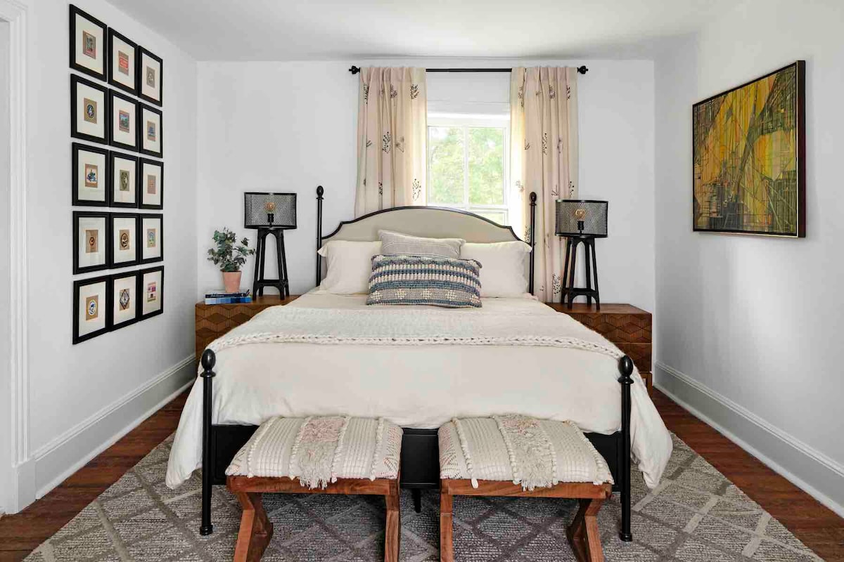 Middle bedroom with queen size bed and Restoration Hardware bedding.  All of our mattresses are a high quality foam material that our guests rave about.  The bedroom also has a dresser and a tv.