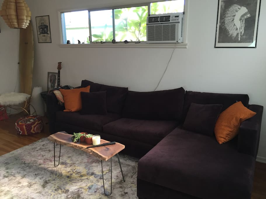 Comfortable couch with chaise lounge, pulls out into a foam top queen mattress! Also has A/C unit.