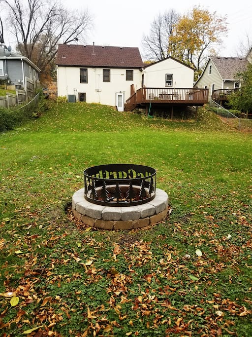 Fire pit and deck w/ patio set and grill