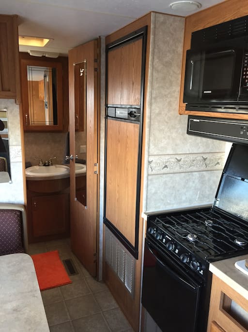 Nice, clean kitchen: stove, oven, microwave, sink