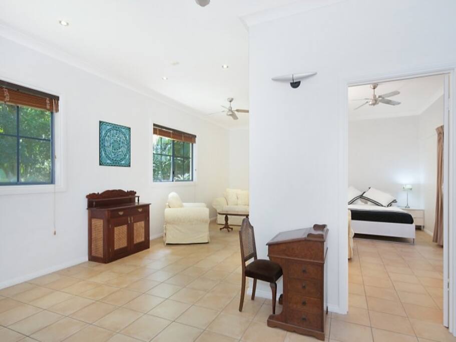 Loungeroom also contains dining table and TV