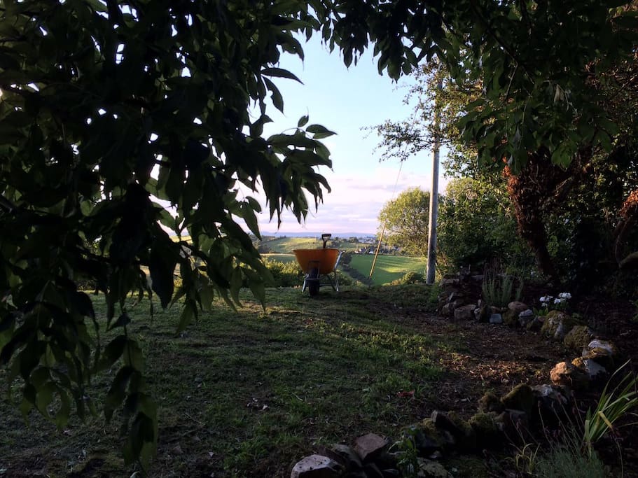 The gardens are surrounded by rolling green hills
