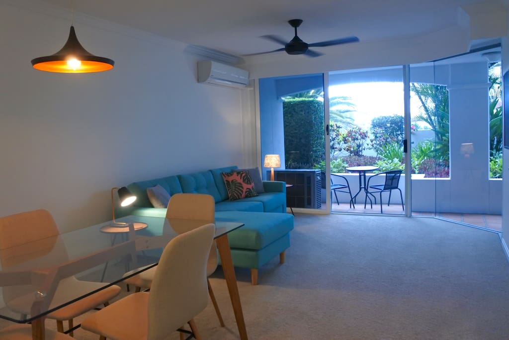 Large open living/dining with large doors to private patio.