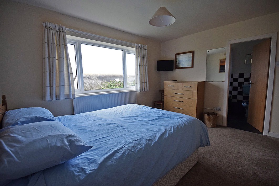 Main bedroom with kings size bed and ensuite bathroom