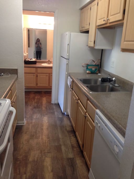 Kitchen to the right when you walk in front door. Stocked with cooking utensils, pots/pans, dishes etc