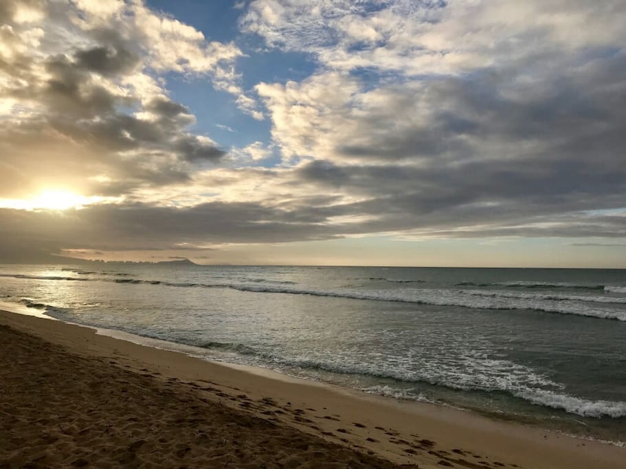 Sandy beach and soft waves make for serene walks up and down the coastline
