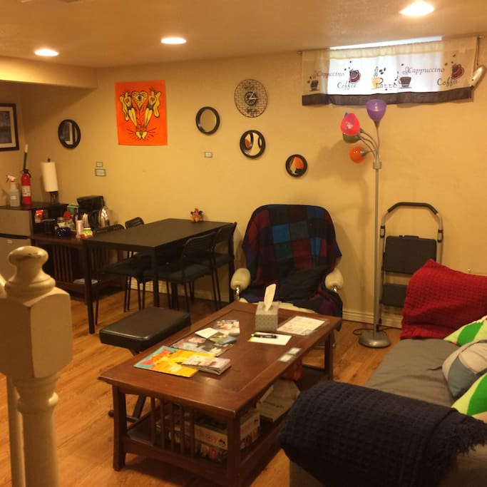 Downstairs living room with mini fridge, coffee, and tea.