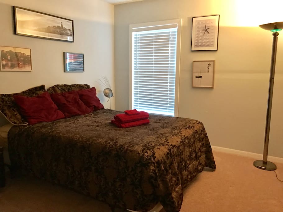 Comfy Queen Bed in the "Lighthouse Room" nicely decorated with a marine theme.