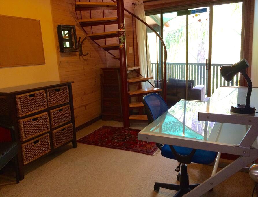 The room is on 2 levels. The lower level includes a desk with Wi Fi & ethernet network access. Access to the loft bedroom above is via a spiral staircase