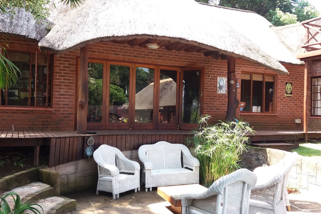Private Guest Suite which has stacking doors that lead onto a wooden deck and entertainment area.