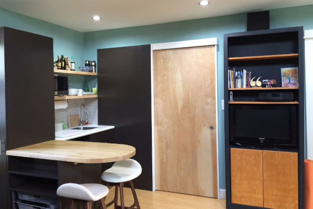 Kitchenette area with microwave and refrigerator