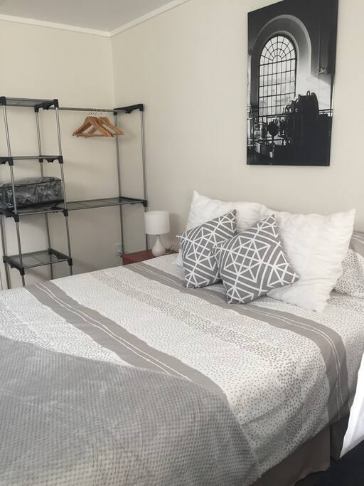 Two bedside drawers with bedside lamps. Extra blanket for cool evenings. Clothes rack with hangers