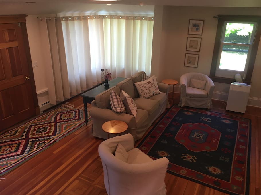 The spacious living room has great sunlight throughout the day but the curtains can be drawn for additional privacy. While there is a flat screen TV with cable, this is also a great space to pull out the board games provided or bring your own!