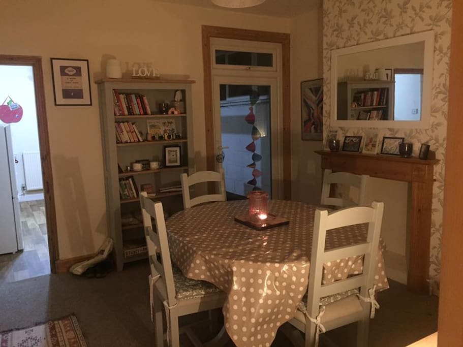 The dining room - the table is big enough to seat four very comfortably. Extra seats can be found in the shed if needed (we have sat six around the table easily!)