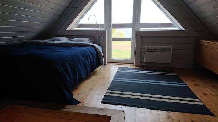 Bedroom with sea view and double bed