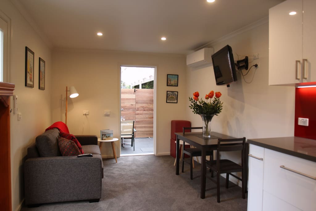 Looking from kitchen across lounge area to rear courtyard