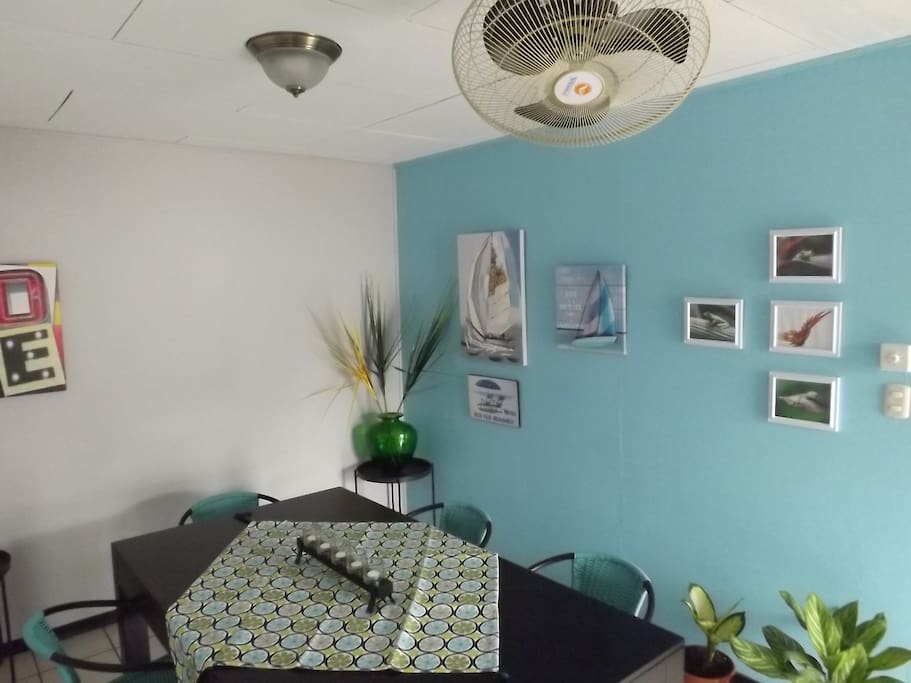 Dining area. To dine, or to work. Ceiling fans, great natural light. And you'll love the decor!