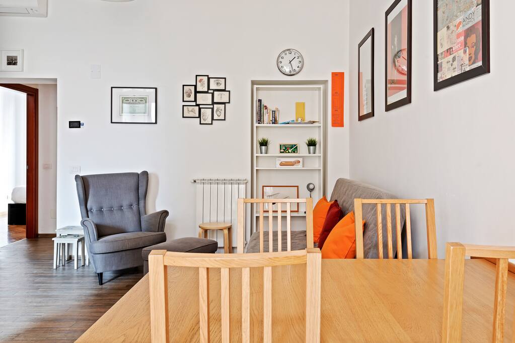 The Living room - The perfect relax area with the sofa bed, the bookcase & the dining table